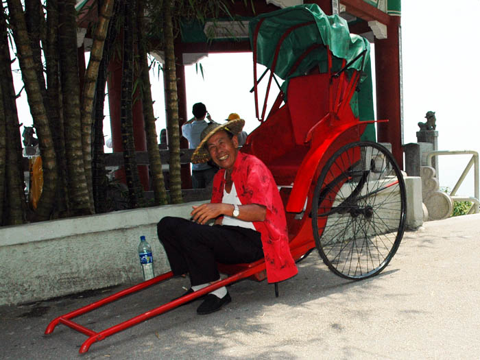 Enterprising on old guy on Victoria Peak. Did only photo ops, no riksha service.